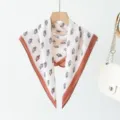 Women's silk square scarf with monogram print and contrast brown border for autumn fashion. - XPM-23