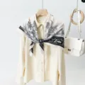 Elegant women's silk scarf with vintage floral print, styled on a chic blouse for daily wear. - Style 1