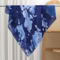 Blue and white tie-dye square scarf detail hanging on a rod with elegant watercolor print design. - Floral 14
