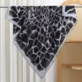 Detailed view of the black and white abstract square silk scarf hanging gracefully on display. - Striped - Gray