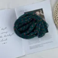 Detailed view of a dark green retro polka dot chiffon scarf, perfect for summer sun protection. - Navy Small Polka Dot