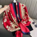 Elegant red silk scarf with blue border and floral print, versatile summer shawl wrap. - Blooming Flowers
