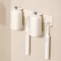 Wall-mounted magnetic toothbrush holder with two cups, modern cream style bathroom organizer. - 2-Cup Toothbrush Holders / Creamy White