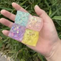 Close-up of square aurora cheese squishy toy detail, colorful glitter slow rebound fidget toy. - Cheese / Random 4 Colors