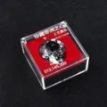 Detailed close-up shot of the multi-faceted crystal ornament in a transparent acrylic display box. - Heart of Africa Boxed