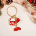 Christmas metal keychain detail showing Santa Claus charm and festive red hat pendants. - Santa Claus Hat Style (YSK-12-4)