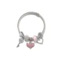 Detailed close-up view of silver charm snake chain bracelet with sparkling crystal heart pendants. - Pink Key Heart Style (AL-01)