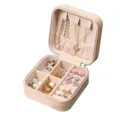 Compact portable pink PU leather jewelry storage box with zip, designed for rings and necklaces. - 10*10*5cm / Pink