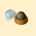 Rotating catnip ball toy with protective cover and base for dental care and fun entertainment. - Catnip Licking Toy [Brown]