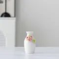 Mini white ceramic vase with handcrafted pink floral decor, elegant tabletop ornament for home decor. - 4A