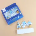 Detail shot of creative space astronaut rocket UFO birthday cake decorative candles set box. - Spaceman Candle 3-Piece Set