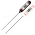Digital meat cooking thermometer with long stainless steel probe and LCD display screen. - White