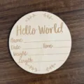 Detailed shot of wooden hello world baby birth announcement milestone disc photo prop. - Diameter 10cm / LK00107