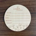 Wooden newborn milestone plaque detail, engraved with hello world and baby birth date lines. - Diameter 10cm / LK00110