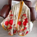 Detailed shot of a luxury vintage long silk scarf with elegant red floral and bird print. - Phoenix Admiring Flowers