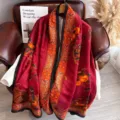 Detailed shot of retro red silk scarf with traditional Chinese persimmon and magpie pattern. - Everything Goes Well