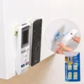 Wall mounted adhesive remote control holder, punch free plastic organizer hook for AC TV. - Green