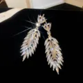 Luxury sparkling zircon leaf tassel earrings, elegant palace banquet crystal jewelry for women. - Gold