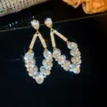 Luxury crystal geometric dangle earrings for women, sparkling rhinestone banquet jewelry. - Gold