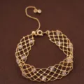 Elegant gold-tone metal mesh crystal beaded bracelet, vintage court style wrist jewelry variant. - Gold/White
