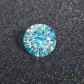 Macro detail shot showing the brilliant cut facets and vibrant blue color of the gemstone. - Blue