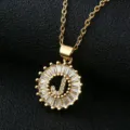 Close-up detail of the luxury gold-plated letter J pendant necklace, sparkling cubic zirconia round frame. - Gold Letter J