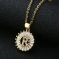 Detail shot of gold-plated copper necklace with sparkling baguette zirconia round letter R pendant. - Gold Letter R Style