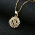 Detailed close-up of a gold-plated copper alphabet N pendant necklace with sparkling cubic zirconia. - Gold Letter N Style