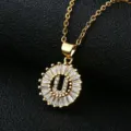 Gold-plated letter U pendant necklace with sparkling cubic zirconia in a circular design. - Gold Letter U Style