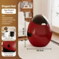 Modern egg-shaped trash can in elegant red, with dual barrel design and push lid for home. - Red
