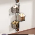 Wandmontierter rotierender Küchen-Aufbewahrungskorb für Zwiebeln, Eier und Knoblauch. - Dreilagig / Transparentes Grau