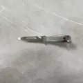 Stainless steel multi-functional kitchen tool peeler, feather clip, and bottle opener design. - 20cm