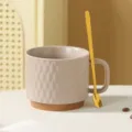 Ceramic coffee cup detail shot, embossed diamond pattern, brown bottom with gold spoon. - Coffee Color + Spoon