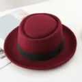 Wine red wool felt porkpie hat with black ribbon, classic British jazz hat detail view. - One Size / Burgundy
