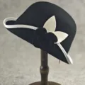 Elegant black wool bucket hat with white trim and delicate camellia flower decoration for women. - One Size approx. 57cm / Black