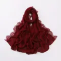 Detailed view of the burgundy chiffon hijab featuring delicate eyelash lace trim and soft fabric. - Dark Red