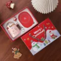 Christmas ceramic mug gift set with warmer, festive pink cup with lid and spoon in gift box. - Pink Mug with Warmer Pad & Christmas Gift Box