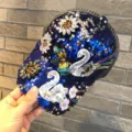 Blue sequin baseball cap featuring sparkling crystal rhinestone swan and flower patches for women. - Swan - Royal Blue
