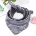 Detailed close-up shot of a solid gray silk scarf, elegant and versatile for summer styling. - Gray