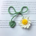 Handmade crochet daisy flower bookmark with green stem and heart leaf for reading lovers. - White