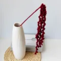 Handmade crochet red hanging flower bouquet in white vase, perfect home decor gift. - Red