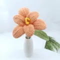 Detailed shot of handmade crochet flower bouquet in white ceramic vase, cozy home decor. - Orange Series A