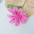 Handcrafted crochet pink yarn flower ornament, exquisite knitted botanical decor variant item. - Purple