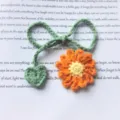 Handmade crochet flower bookmark with green stem and heart, cute knitted page marker for books. - Orange