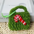 Handmade Christmas crochet coin purse and earphone protective case with cute candy cane design. - Christmas Candy Bags