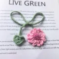 Handmade crochet flower bookmark with cute green bow and leaf, perfect reading accessory. - Pink