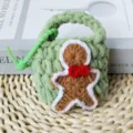 Green crochet mini pouch with cute gingerbread man design, portable earphone case. - Christmas Cookie Bag