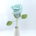 Handcrafted crochet blue rose flower with stem and green leaves in white vase home decor - Crystal Blue