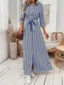 Detail view of the blue and white striped shirt dress featuring a waist belt and side slit. - S / Blue White Vertical Stripes