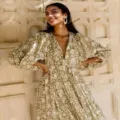 Detailed view of a green floral boho maxi dress with V-neck and bubble sleeves. - S / Green White Print